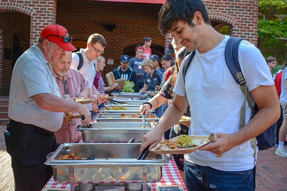 NC State students, staff and visitors go through the food line during the All Carolinas Meal at Fountain Dining Hall on Tuesday, Sept. 10, 2019. The All Carolinas Meal is an annual event hosted by NC State Dining that highlights Carolina themed food, music, and farming.