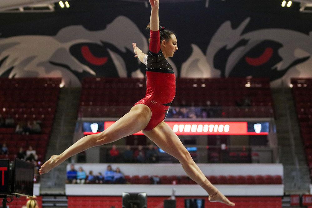 Lauren Kent, a junior studying business administration, performs her beam routine at Reynolds Coliseum on Feb. 1, 2020. Kent scored 9.850 on the event typing for third place with teammates Chloe Negrete and Alexis Beucler. The Wolfpack defeated the Tar Heels 196.250-193.375 setting a season record high.