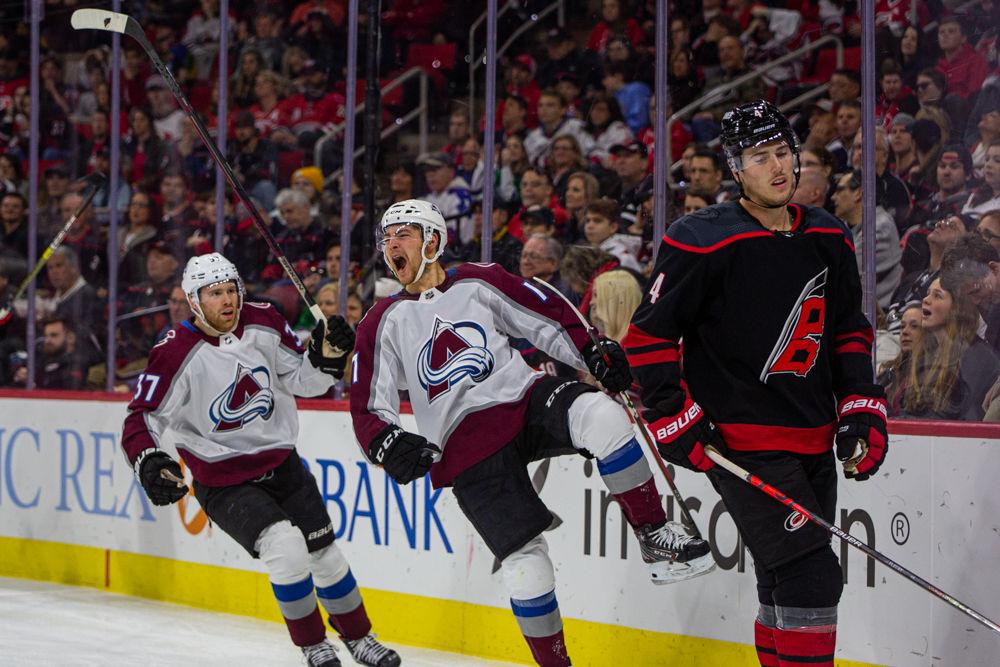 Avalanche center Tyson Jost celebrates his goal versus the Canes as Hurricanes defenseman Haydn Fleury looks on in disappointment on Friday, Feb. 28, 2020 at PNC Arena. Jost had two goals on four shots in the 3-2 win over the Carolina Hurricanes.