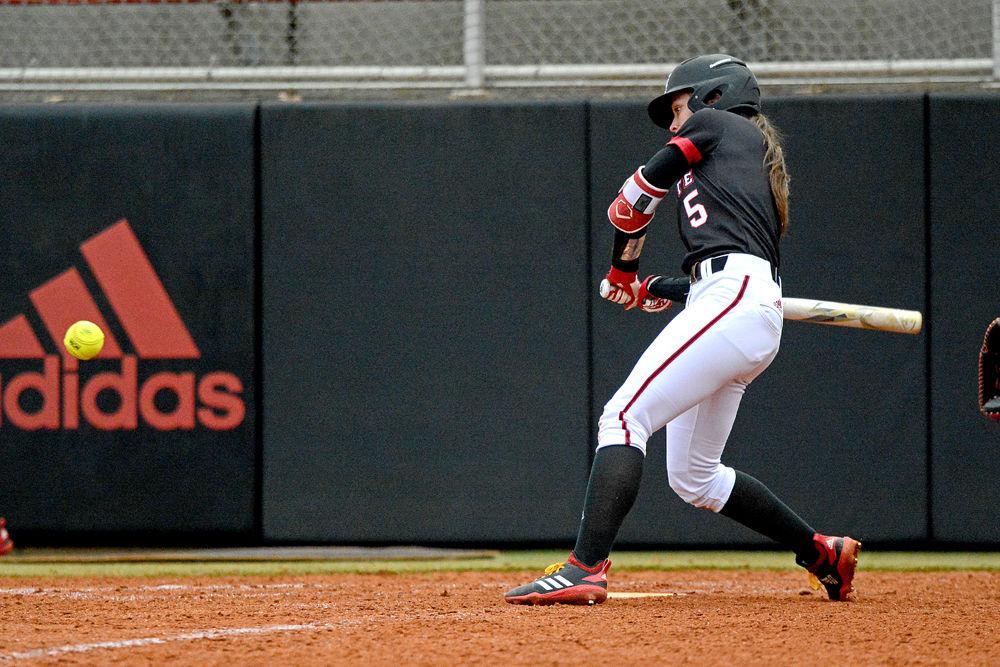 Freshman infielder April Visser takes a swing against Wisconsin on Sunday, Feb. 17, 2019 at Dail Softball Stadium. Visser went 0-3 with one strikeout in the Wolfpack&#8217;s 6-3 loss.