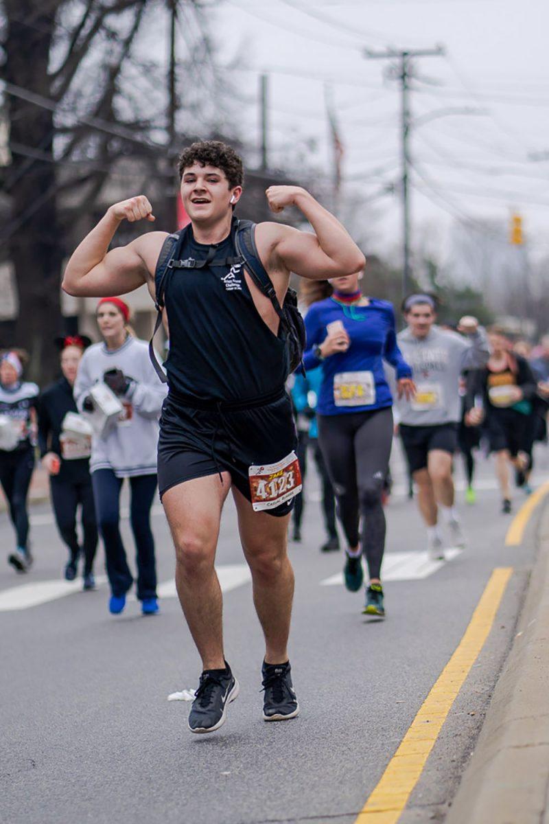 Runner Jake Rennie coming down the final stretch of the 2020 Krispy Kreme Challenge on Saturday, Feb. 1.