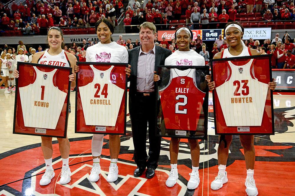 Seniors Aislinn Konig, Erika Cassell, Kaila Ealey, and Grace Hunter are awarded jerseys by head coach Wes Moore during Senior night against Syracuse on Thursday, Feb. 27, 2020 at Reynolds Coliseum. NC State beat Syracuse 69-60.