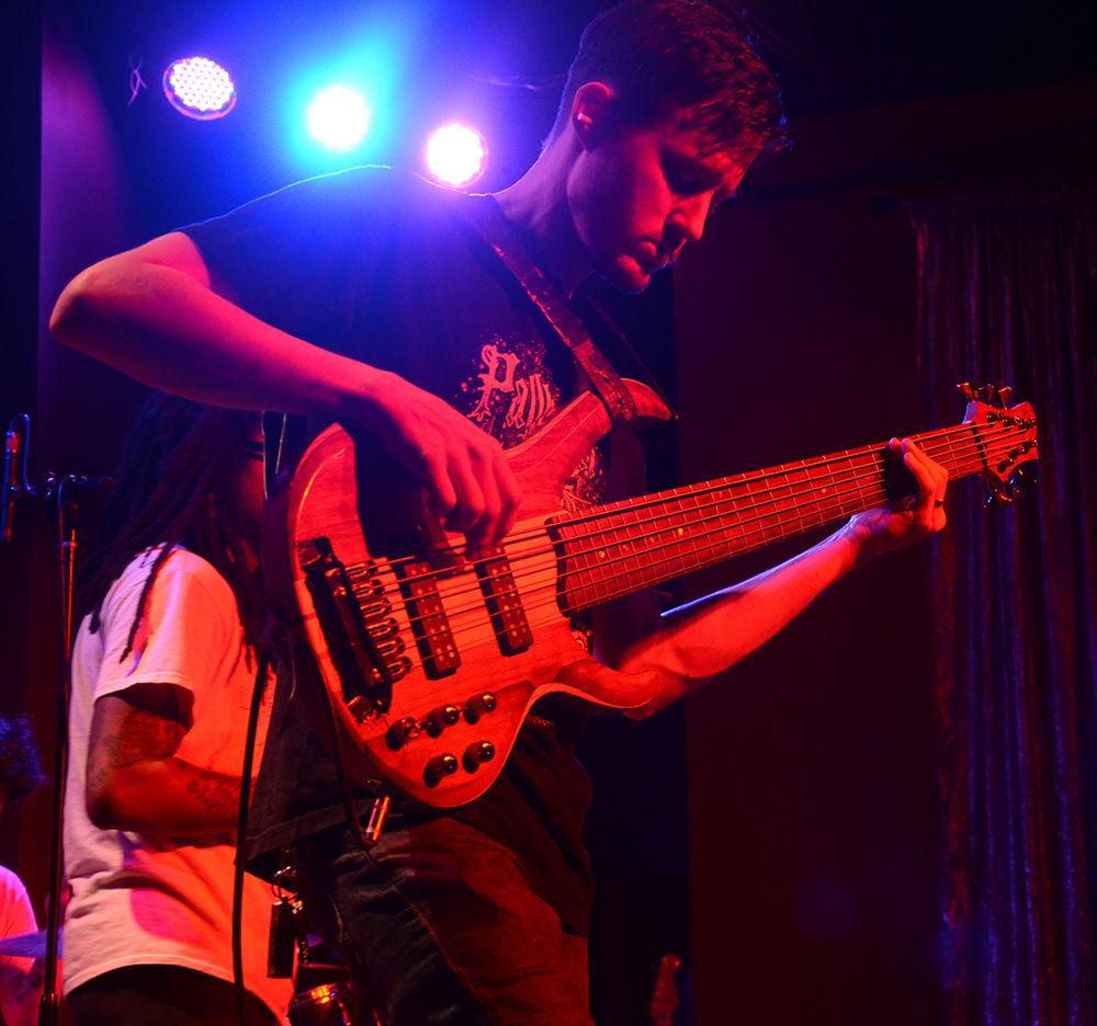 Junior Astronomer's guitarist makes sure that he's in tune before performing at the Double Barrel Benefit Concert at Kings on Saturday, Feb. 8, 2020.