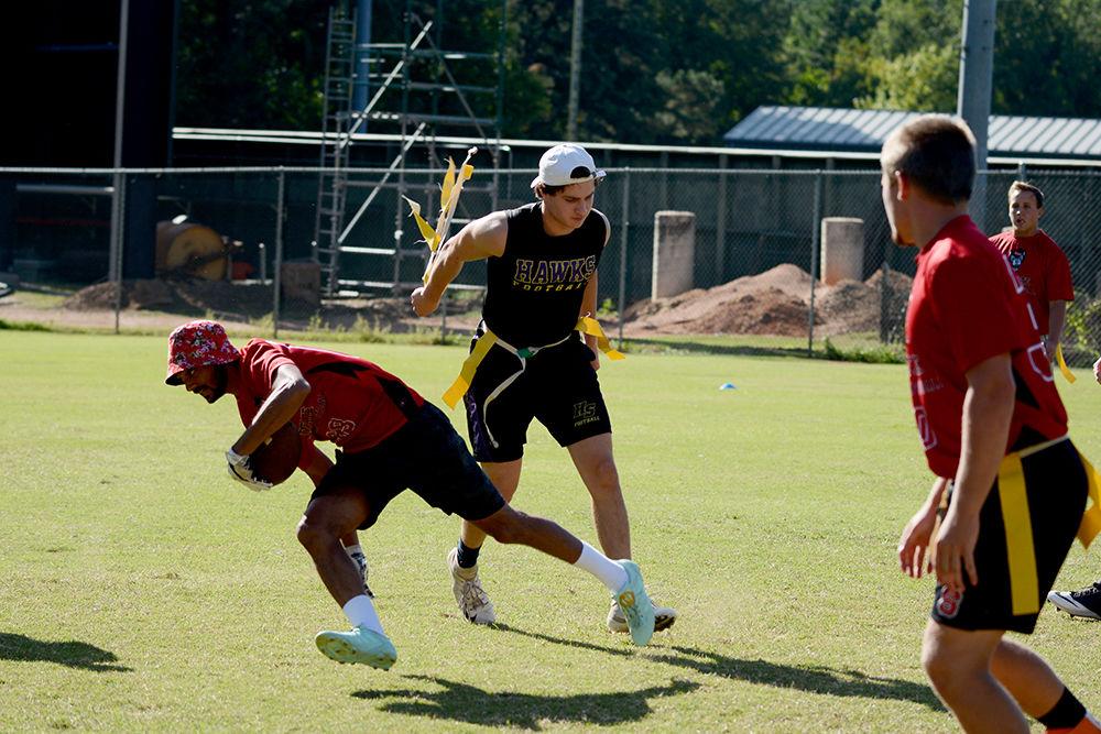First year studying exploratory studies Luca Hurst successfully pulls fifth year studying statistics Vidusha Rao's flags during a club flag football team scrimage at practice. The team has begun preparing for games against local schools in the Triangle.