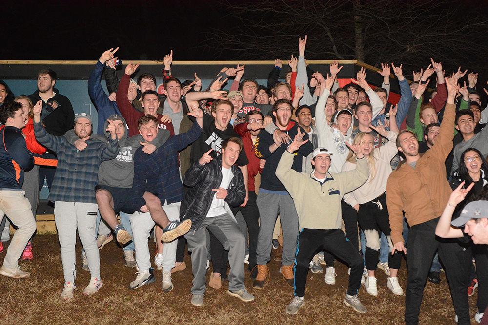 NC State students rush the Bell Tower after the 88-66 win over Duke on Wednesday, Feb. 19, 2020. Hillsborough Street flooded with Wolfpack fans in support of the men&#8217;s basketball team win.