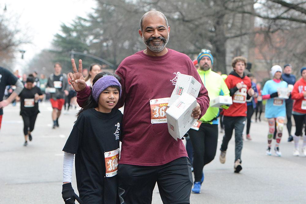 Anvita Jain and Ankur Jain smile with glee during the Krispy Kreme Challenge on Saturday, Feb. 1, 2020.