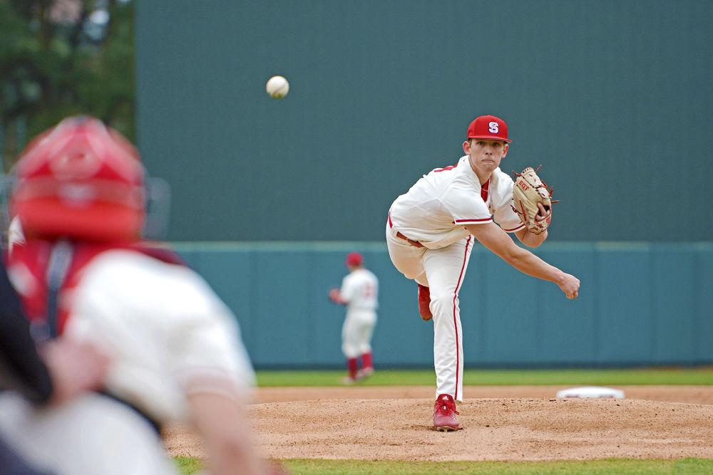 Sophomore pitcher Reid Johnston warms up before facing Minnesota on Sunday, March 3, 2019 at Doak Field. Johnston pitched four innings, striking out two while giving up two earned runs on four hits and three walks. The Wolfpack won 5-4 via junior catcher Brad Debo&#8217;s walk-off base hit.
