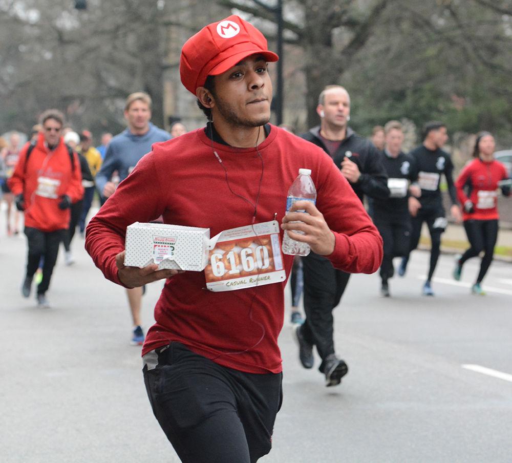 Ammar Malaih takes big strides during the Krispy Kreme Challenge on Saturday, Feb. 1, 2020.