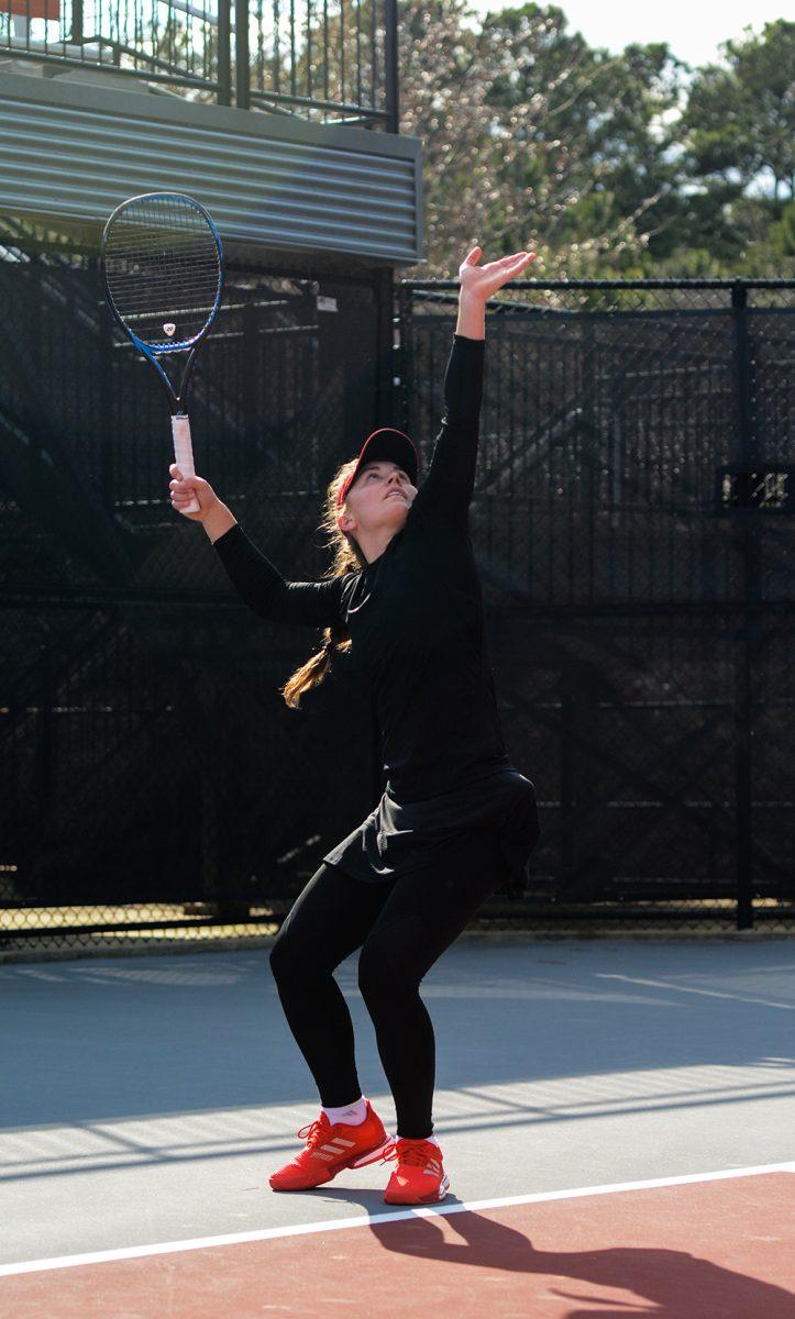 Freshman Lana Mavor prepares to serve during in singles match at the J.W. Isenhour Tennis Center on Friday, Feb. 28, 2020. Mavor won straight sets, winning 6-4 and 6-3.