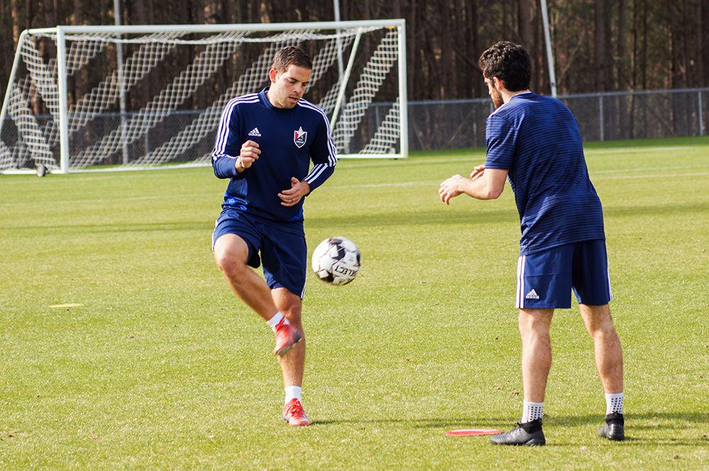 Midfielder Ben Speas volleys a ball back at a teammate during the first NCFC practice of the season on Monday, Feb. 3, 2020, at WakeMed Soccer Park. Speas spent last season with the club on loan from Indy Eleven but the playmaker penned a contract with NCFC this offseason.