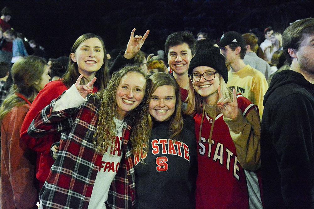 NC State students rush the Bell Tower after the 88-66 win over Duke on Wednesday, Feb. 19, 2020. Hillsborough Street flooded with Wolfpack fans in support of the men&#8217;s basketball team win.
