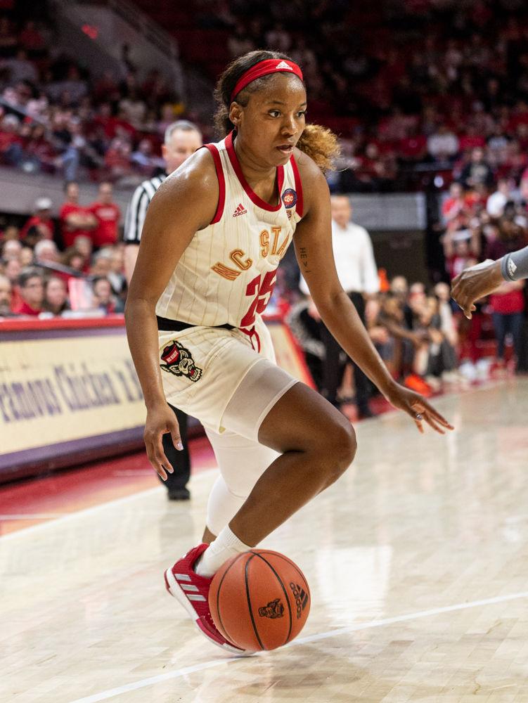 Junior forward Kayla Jones dribbles the ball versus Louisville on Thursday, Feb. 13, 2020 at Reynolds Coliseum. Jones tallied 17 points and shot eight for fourteen from the field. The Wolfpack lost the game 66-59 to the ninth ranked Louisville.