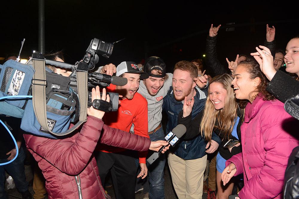 NC State students speak with WRAL multimedia journalist Rosalia Fodera after rushing the Bell Tower after the 88-66 win over Duke on Wednesday, Feb. 19, 2020. Hillsborough Street flooded with Wolfpack fans in support of the men&#8217;s basketball team win.