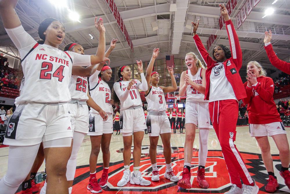 The team comes together after the alma mater to celebrate one more time before heading to the locker room after the 76-68 win over UNC in Reynolds Coliseum on Sunday, Jan. 27, 2020.