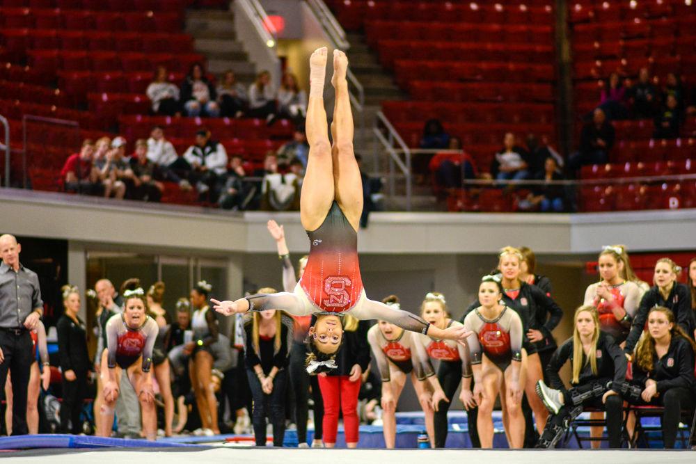 Junior Drew Grantham performs her floor routine at the gymnastics meet against Western Michigan and William &amp; Mary on Friday, Feb. 22, 2019 at Reynolds Coliseum. Grantham was first in the vault and last in the all-around. The Wolfpack won with a score of 195.350 to Western Michigan's 193.675 and William and Mary's 190.800.