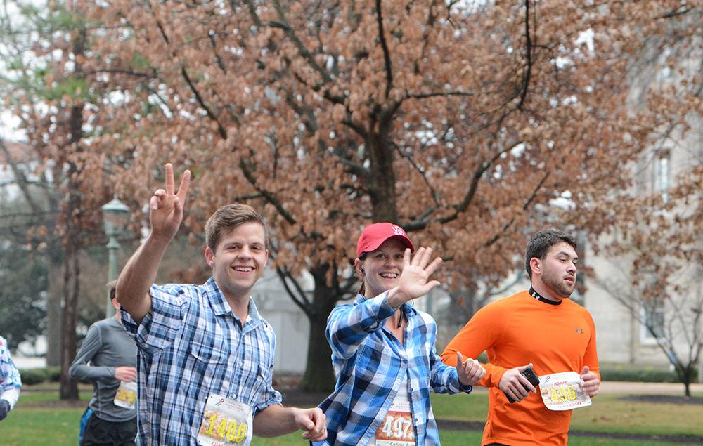 Ian Schutt, Emma Brennan, and Adam Lebrecht race towards the finish during the Krispy Kreme Challenge on Saturday, Feb. 1, 2020.