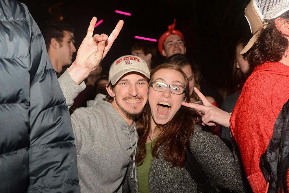 NC State students rush the Bell Tower after the 88-66 win over Duke on Wednesday, Feb. 19, 2020. Hillsborough Street flooded with Wolfpack fans in support of the men&#8217;s basketball team win.