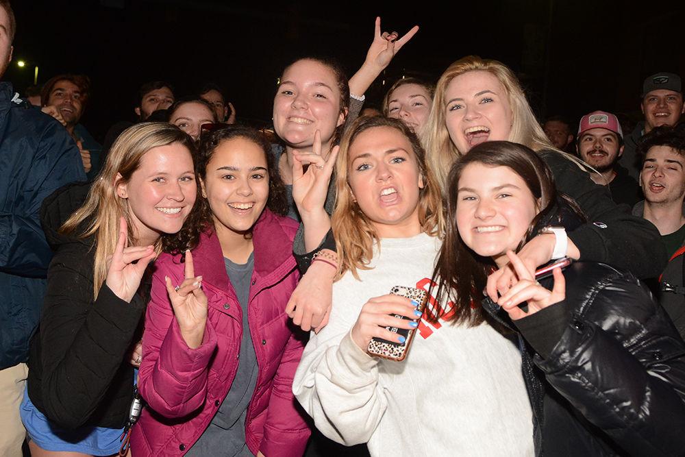 NC State students rush the Bell Tower after the 88-66 win over Duke on Wednesday, Feb. 19, 2020. Hillsborough Street flooded with Wolfpack fans in support of the men&#8217;s basketball team win.