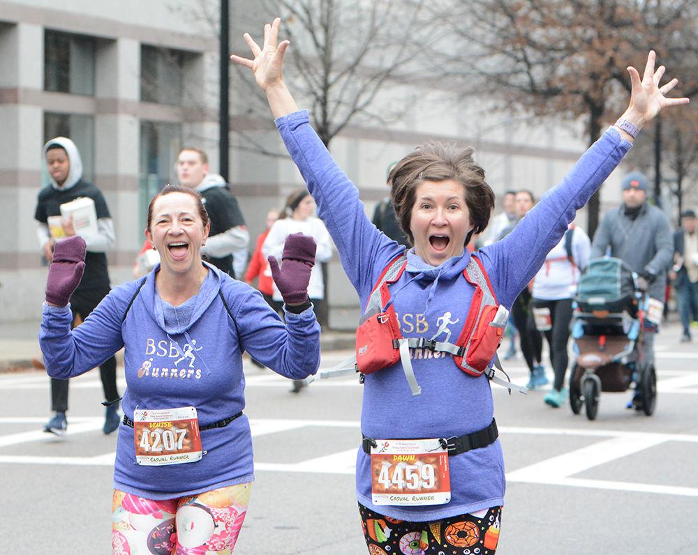 Denise Seamster and Dawn Wilson show excitement during the Krispy Kreme Challenge on Saturday, Feb. 1, 2020.