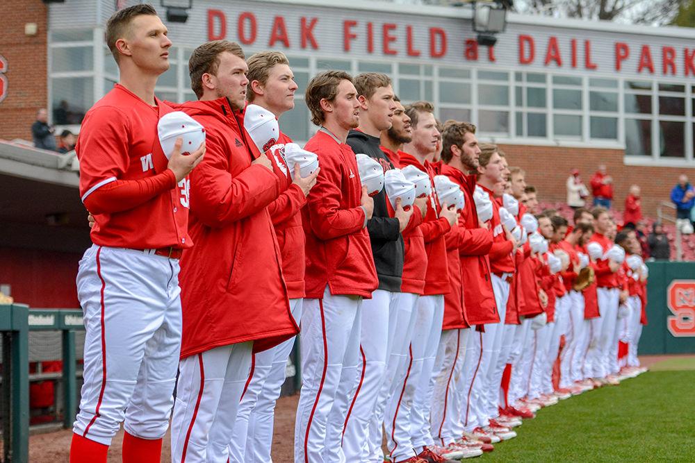 The NC State baseball team stands for the national anthem before the game versus the Bucknell Bison on Saturday, Feb. 16, in Doak Field at Dail Park. The Wolfpack beat the Bison 14-2.