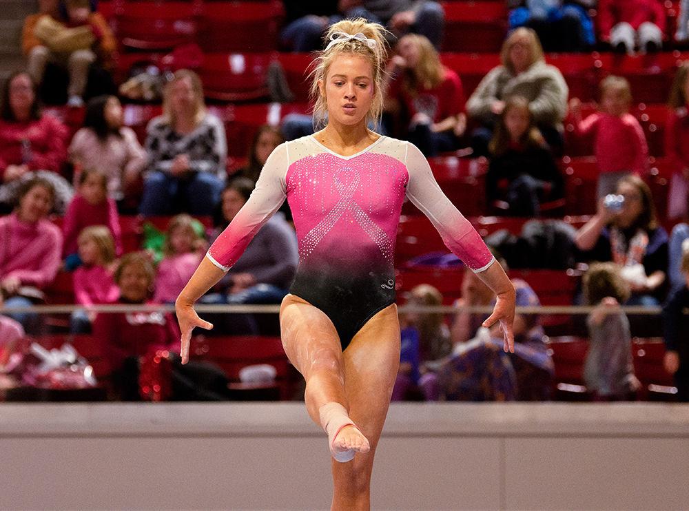 Kasey Nelson balances on one foot during her Balance Beam performance on Saturday, Feb. 15 at Reynolds Coliseum. Nelson finished fourtheenth on the Balance Beam with a score of 9.650.