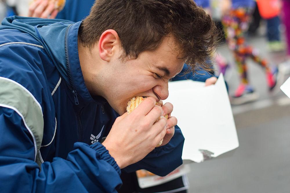 Challenger Adrian Pinto-Dimeglio chows on six stacked doughnuts during the Krispy Kreme Challenge on Saturday, Feb. 1, 2019 in Raleigh, NC. The Challenge benefits the UNC Children's Hospital.