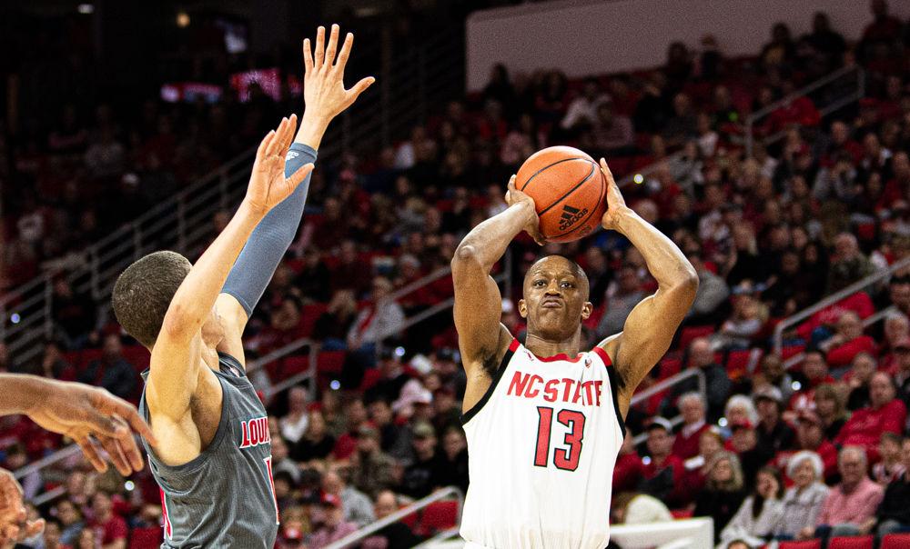 Redshirt senior guard C.J. Bryce shoots against Louisville on Saturday, Feb. 1 at PNC Arena. Bryce scored a team-high 15 points as the Wolfpack lost 77-57.