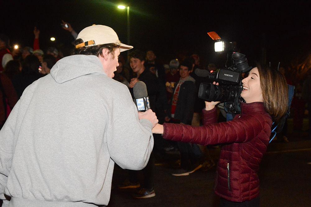 An NC State student speaks with WRAL multimedia journalist Rosalia Fodera after rushing the Bell Tower after the 88-66 win over Duke on Wednesday, Feb. 19, 2020. Hillsborough Street flooded with Wolfpack fans in support of the men&#8217;s basketball team win.