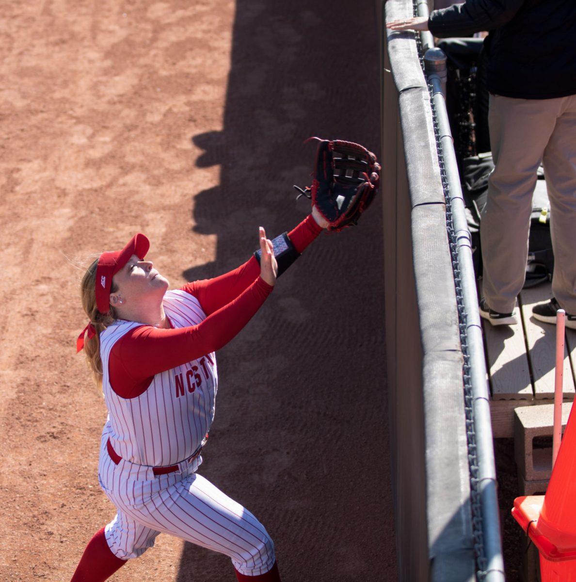Senior Skylar Johnston attempts to catch a foul ball on Friday, Feb. 28 at Dail Softball Stadium. NC State won 12-2 against Lehigh as the first part of a four game NC State Invitational.