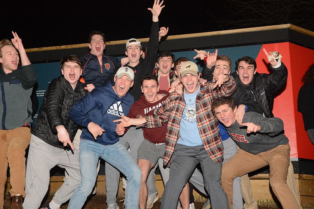 NC State students rush the Bell Tower after the 88-66 win over Duke on Wednesday, Feb. 19, 2020. Hillsborough Street flooded with Wolfpack fans in support of the men&#8217;s basketball team win.