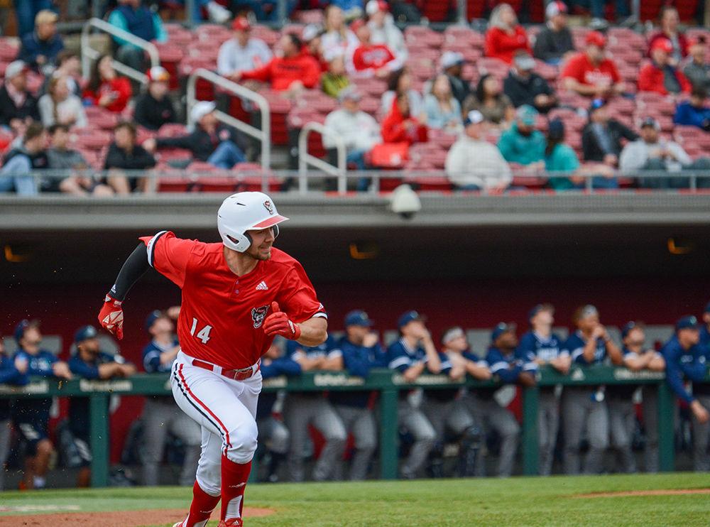 Junior outfielder Jonny Butler runs to first base during the game against UNCW at Doak Field on Tuesday, Feb. 25, 2020. The Wolfpack beat the Seahawks 11-0.