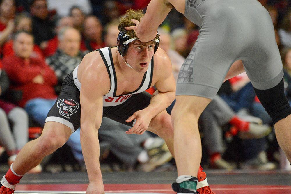 Redshirt freshman Trent Hidlay stares up at his opponent. Hidlay was defeated 3-1 by Hunter Bolen. #3 NC State defeated #7 Virginia Tech 21-18 on Friday, Feb. 14, 2020 at Reynolds Coliseum.