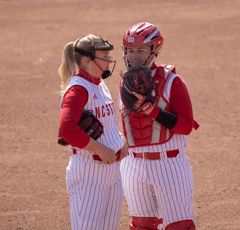 Sophomore relief pitcher, Sydney Nester, shares a word with catcher, Sam Sack on Friday, Feb. 28 at Dail Softball Stadium. Nester had three strikeouts en route to a 7-3 pitcher win for her, while NC State won 12-2 over Lehigh.