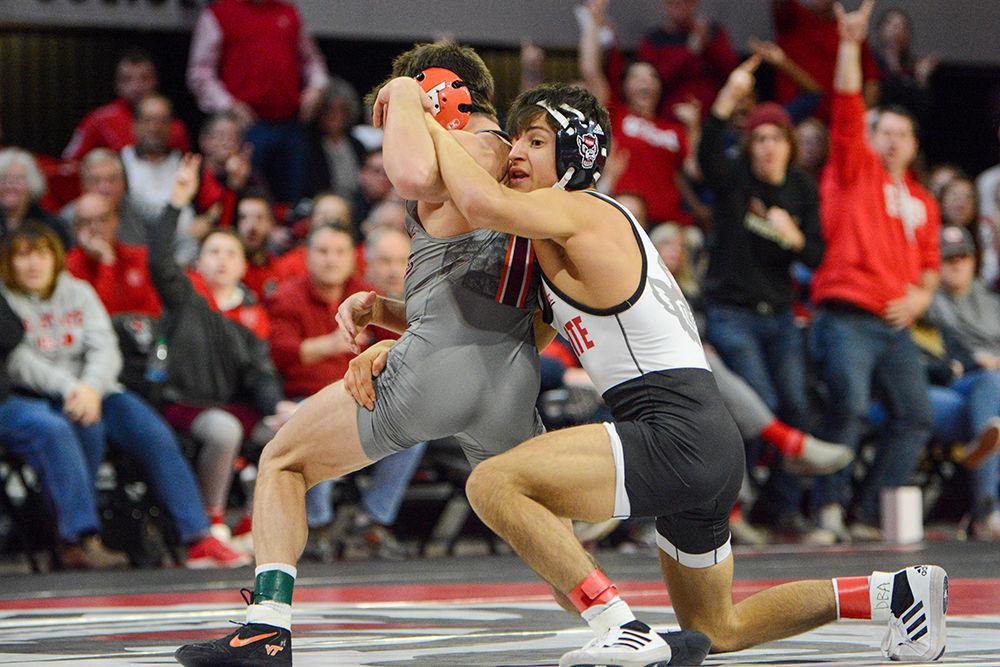 Redshirt freshman Jakob Camacho takes down his opponent. Camacho defeated his opponent Joey Prata 5-4. NC State defeated Virginia Tech 21-18 on Friday, Feb. 14, 2020 at Reynolds Coliseum.