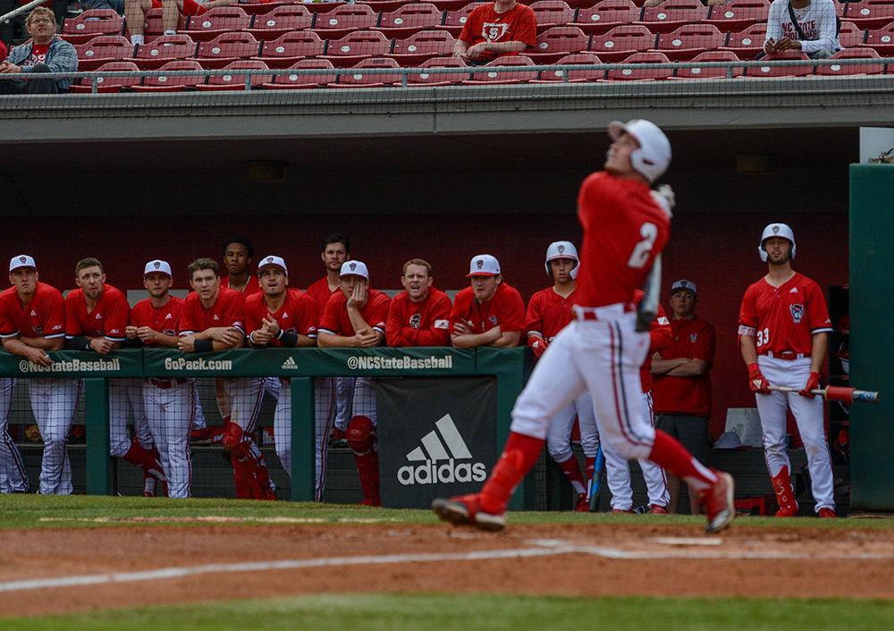 The Wolfpack Baseball team looks on along with freshman outfielder Noah Soles to see where the ball will go at Doak Field on Tuesday, Feb. 25, 2020. The Wolfpack beat the Seahawks 11-0.