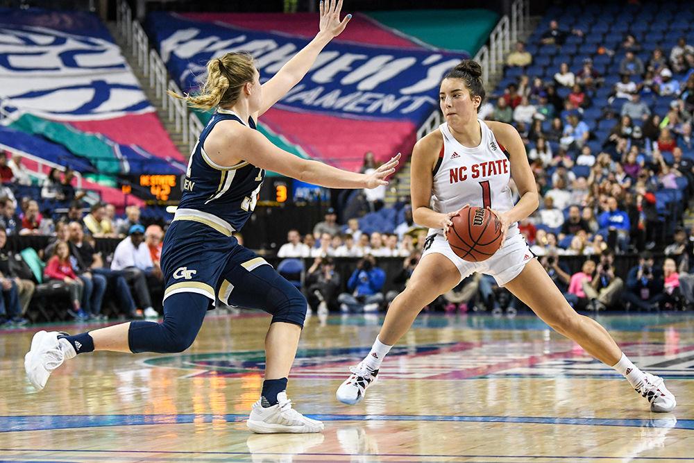 Senior guard Aislinn Konig looks for a pass during the quarterfinal game of the 2020 ACC Women's Tournament versus the Georgia Tech Yellow Jackets on Friday, March 6, 2020 in the Greensboro Coliseum. Konig scored 16 points against Georgia Tech. The Wolfpack beat the Yellow Jackets 57-48.