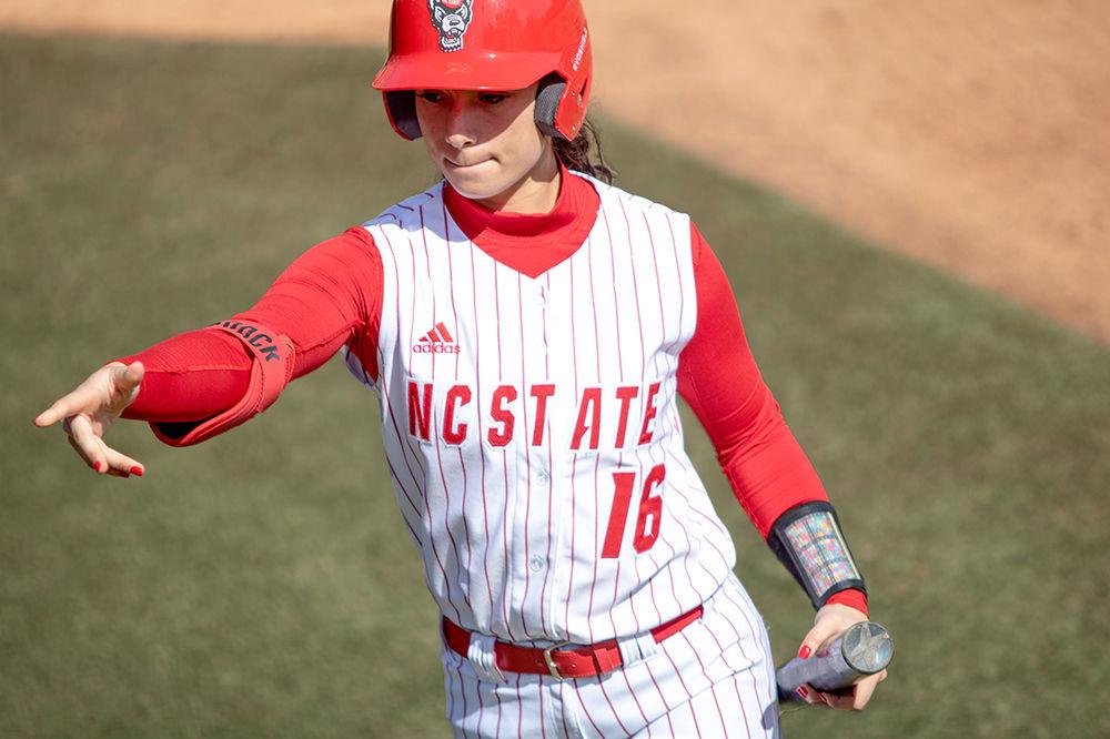 Senior outfielder, Tatyana Forbes, reaches towards her bench during NC State&#8217;s 12-2 win over Lehigh on Friday, Feb. 28 at Dail Softball Stadium. Forbes had one RBI from her two hits out of four at bats.
