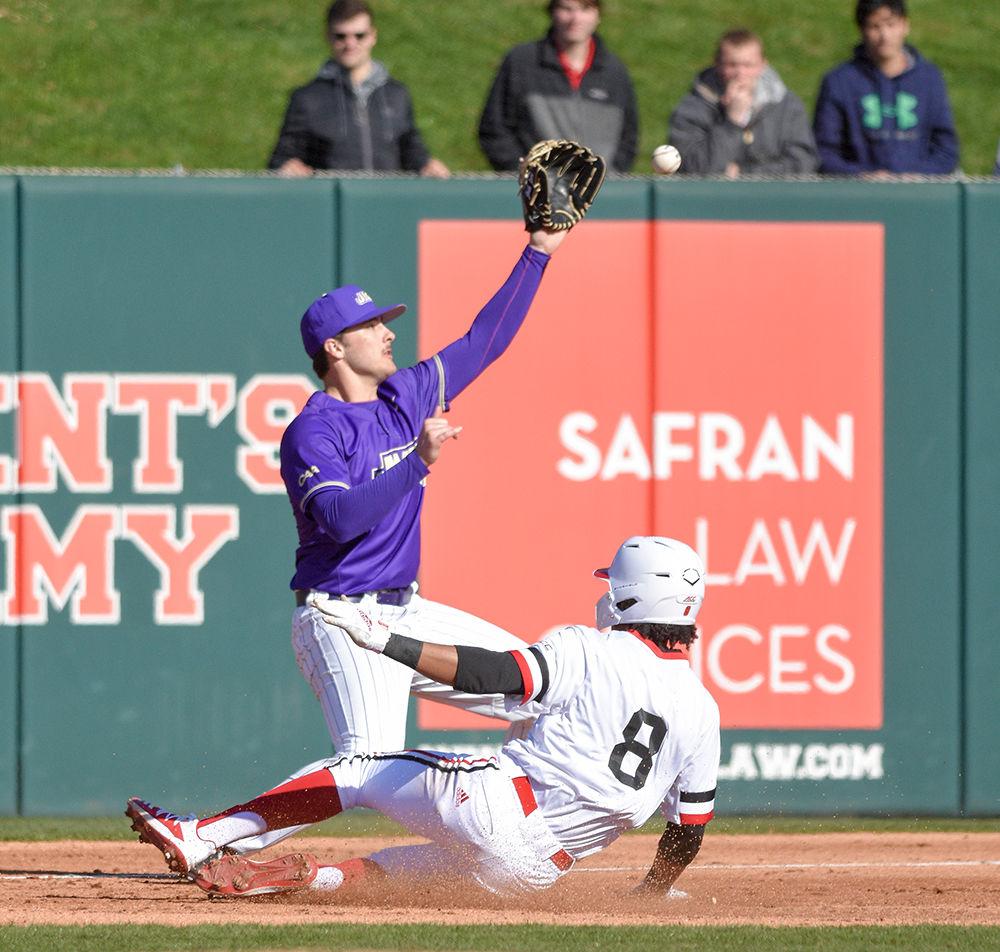 Freshman infielder Jose Torres slides into third base during the game against James Madison University at Doak Field on Saturday, Feb. 15, 2020. Torres got one run during the game.