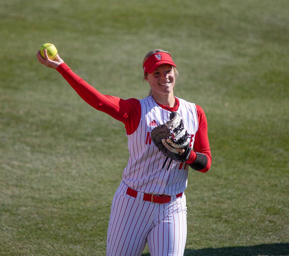Freshman Libby Whittaker, throws to her teammate while warming up in between innings on Friday, Feb. 28 at Dail Softball Stadium. NC State beat Lehigh 12-2 in only six innings.
