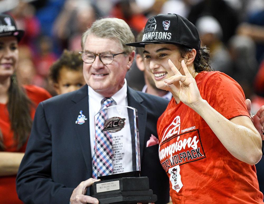 Senior guard Aislinn Konig holds up a wolfie after winning MVP of the 2020 ACC Women's Tournament championship versus Florida State University on Sunday, March 8, 2020 in the Greensboro Coliseum.&#160;The Wolfpack beat the Seminoles 71-66 to win their first ACC title since 1991.