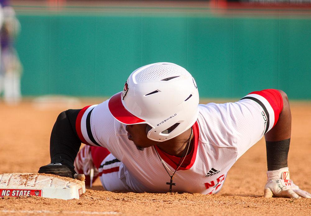 Third year Devonte Brown looks for the tag at first at the baseball game against James Madison on Saturday, Feb. 15 at Doak Field. Brown batted batted .286 his sophomore season.