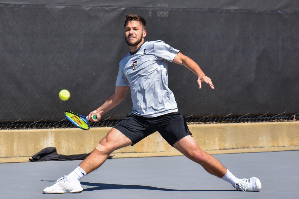 Junior team captain Alexis Galarneau wins 6-3, 6-4 against Louisville senior team captain Christopher Morin-Kougoucheff. The Wolfpack won against Louisville 4-1 on Sunday, March 17, 2019 in The J.W. Isenhour Tennis Center.