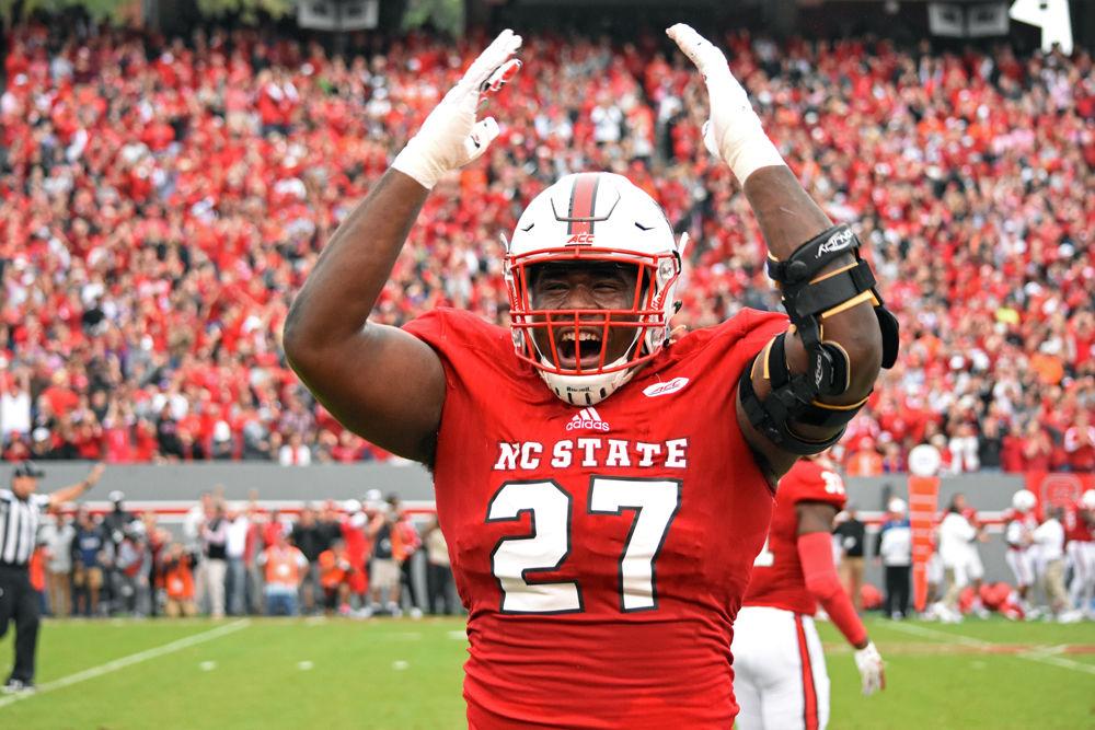 Senior defensive tackle Justin Jones hypes up the crowd in between plays at the Homecoming game against Clemson in Carter-Finley Stadium on Saturday, Nov. 4, 2017. The Wolfpack lost 38-31.