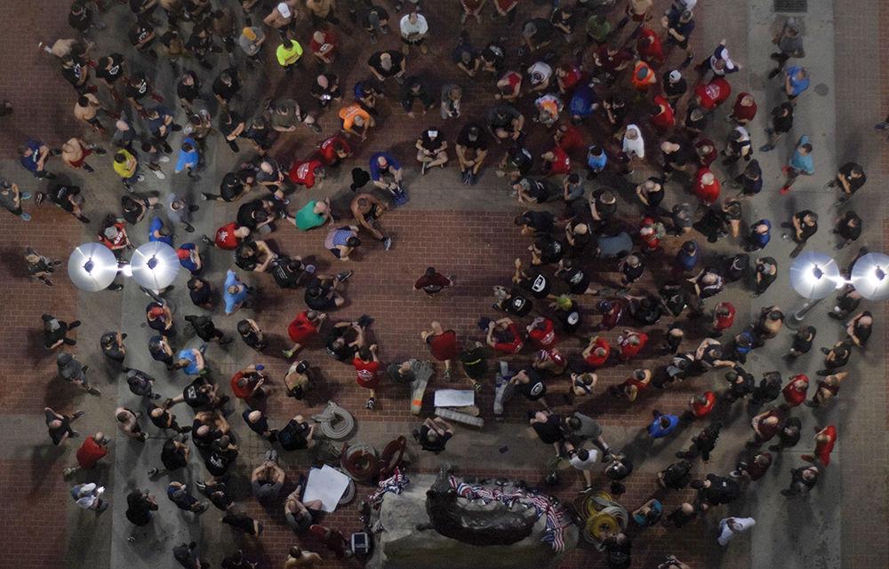 F3 members and people from across Raleigh pray after their annual 9/11 Stair Climb on Wednesday, Sept. 11, 2019 at Carter-Finley Stadium. The group climbed 110 flights in remembrance of the lives lost in the World Trade Center in 2001.