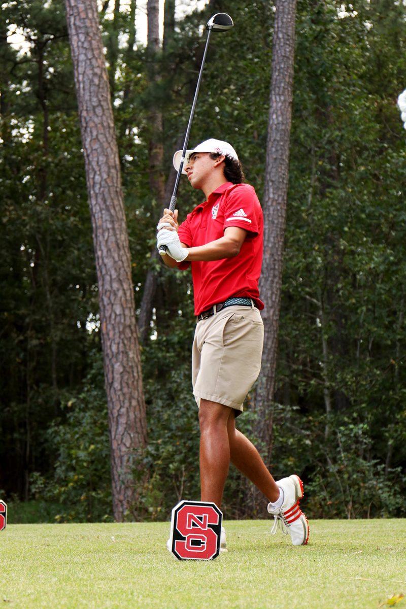 Junior Christian Salzer watches the ball as it soars down range. Salzer finished round 2 with a score of -3 at Lonnie Poole Golf Course on Oct. 6th 2018.