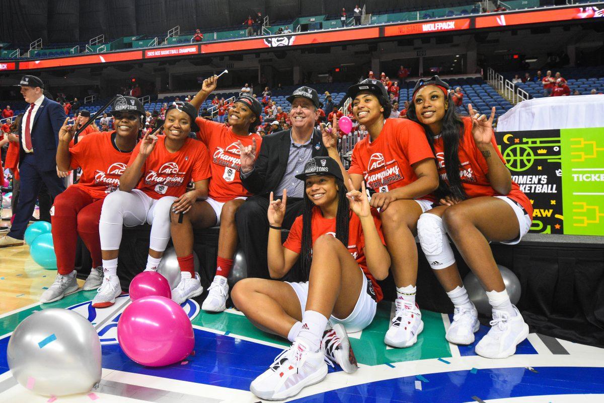 The NC State women's basketball team poses with the championship trophy after the team won the 2020 ACC Women's Tournament on Sunday, March 8, 2020 in the Greensboro Coliseum.&#160;The Wolfpack beat the Seminoles 71-66 to win their first ACC title since 1991.