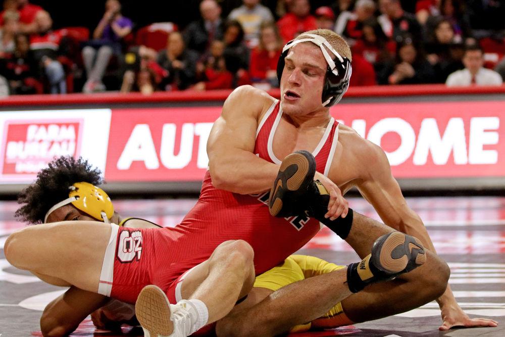 Redshirt sophomore Hayden Hidlay holds down Appalachian State&#8217;s Angel Najar at Reynolds Coliseum on Tuesday, Dec. 4. Hidlay won the final match before the break with a score of 10-2. The Wolfpack won against Appalachian State 29-9.
