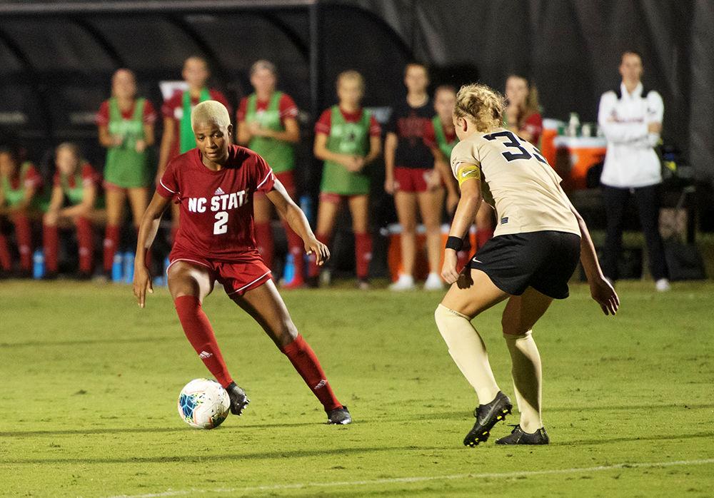 Senior midfielder Tziarra King attempting to maneuver past an opponent during the Wake Forest vs. NC State soccer match on Sunday, Sept. 29, 2019 at W. Dennie Spry stadium. King scored the only goal in a match that saw NC State and Wake Forest tie 1-1.