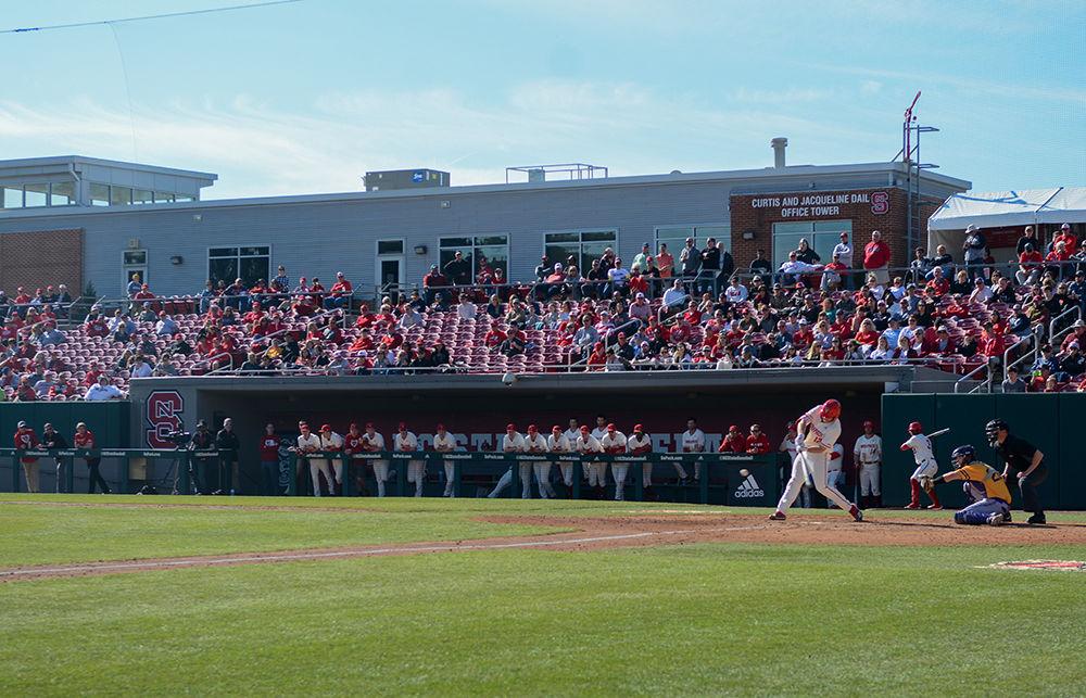 The Wolfpack Baseball team and spectators watch on as Senior catcher Brad Debo swings agaisnt Tennessee Tech at Doak Field on Sunday, Feb. 23, 2020. The Wolfpack beat the Golden Eagles 15-1.