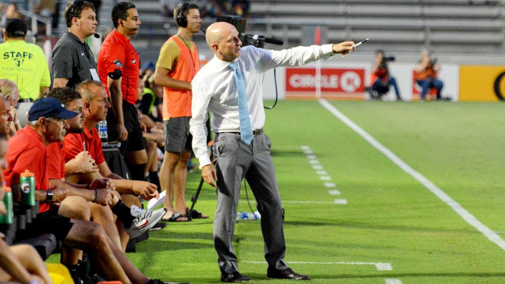 NC Courage head coach Paul Riley talks with an assistant during the club's match against Reign FC at WakeMed Soccer Park on Saturday, July 13, 2019. The Courage topped the Reign, 2-0.